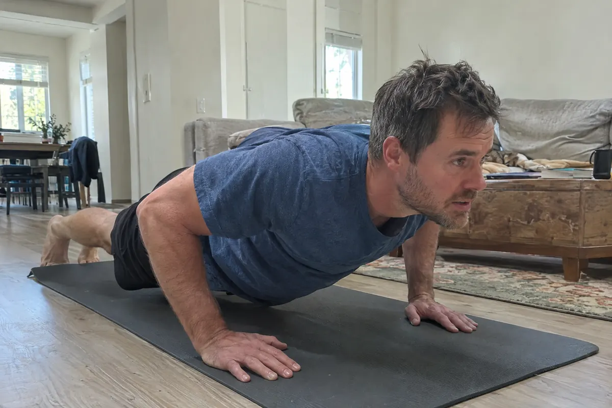 Push-ups on a mat in the living room